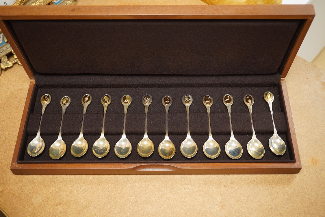An Elizabeth II cased set of twelve Royal Society for the Protection of Birds parcel gilt silver teaspoons by John Pinches, London, 1975, 13.2cm.